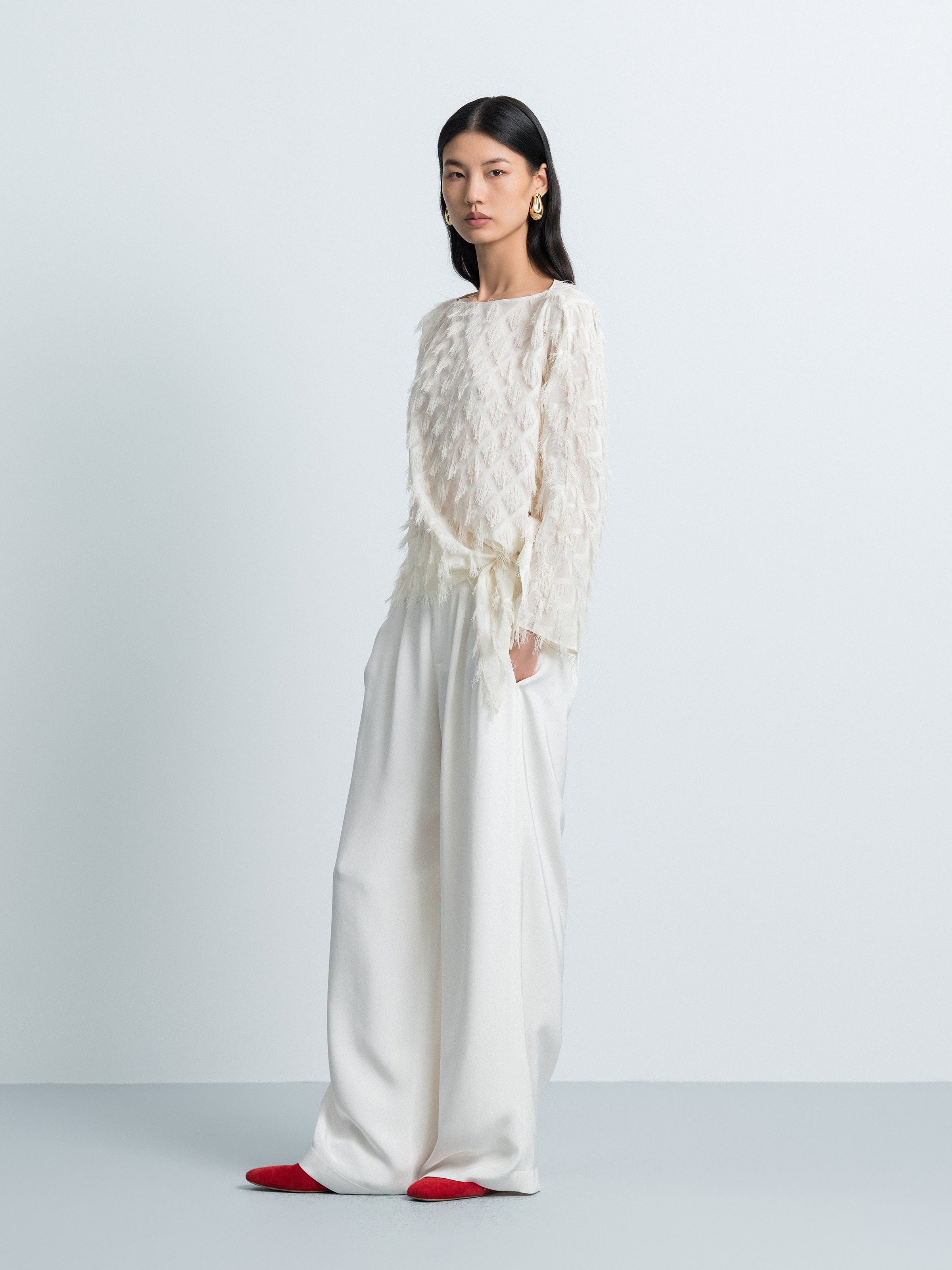 Asymmetric Hem Top with Tassel Details