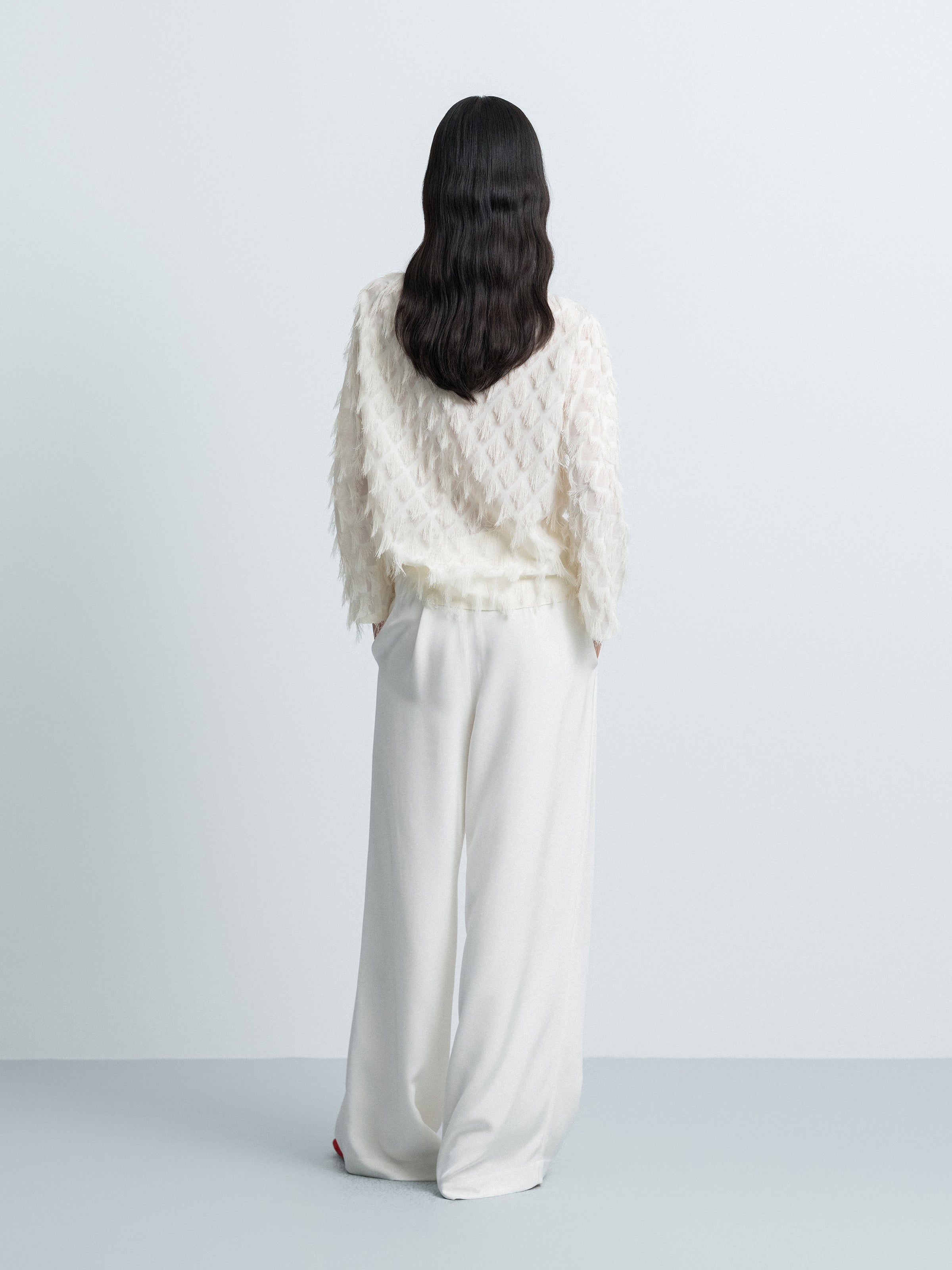 Asymmetric Hem Top with Tassel Details
