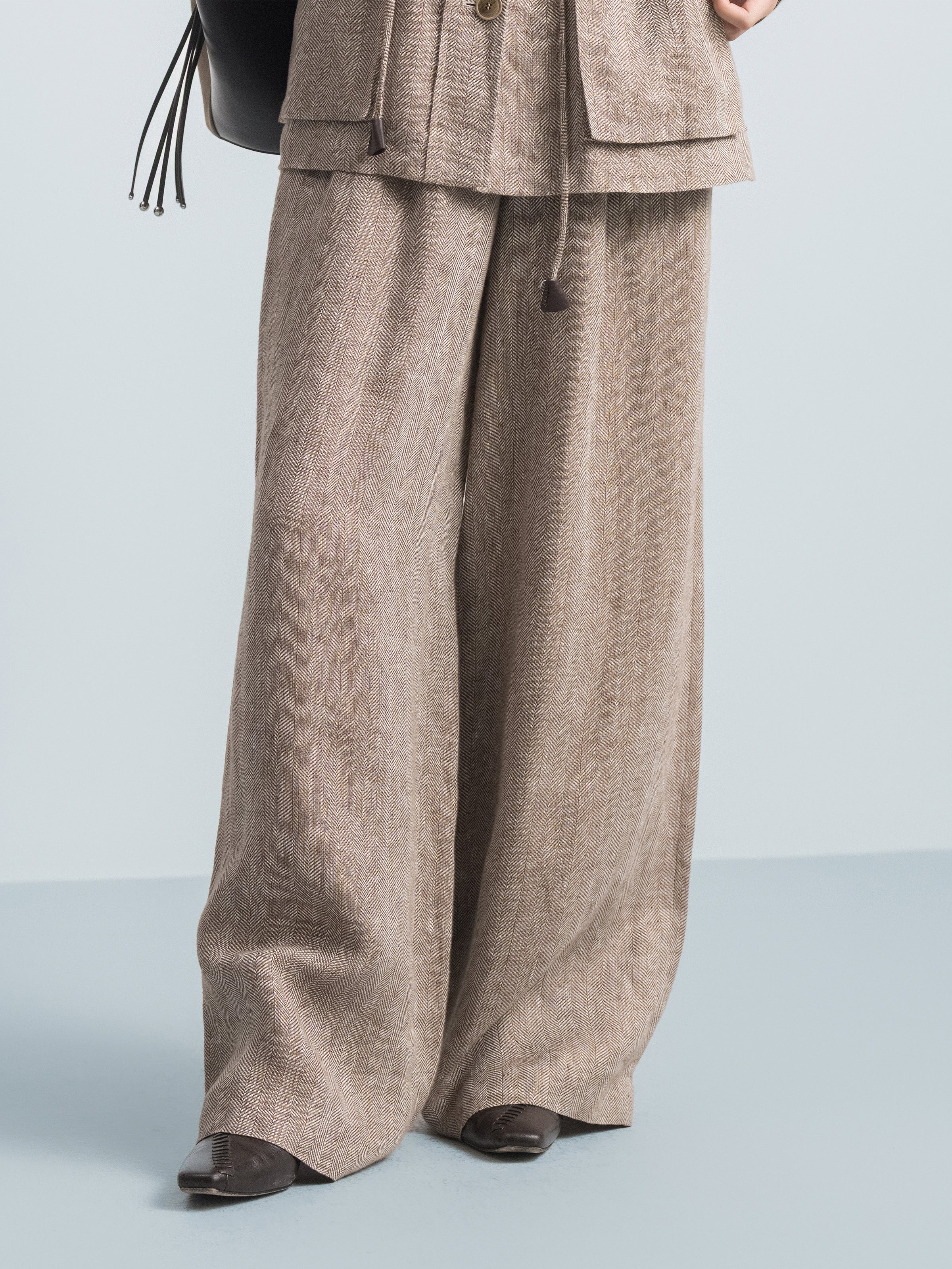 Coffee brown high-waist wide-leg trouser legs with draped, wide hem
