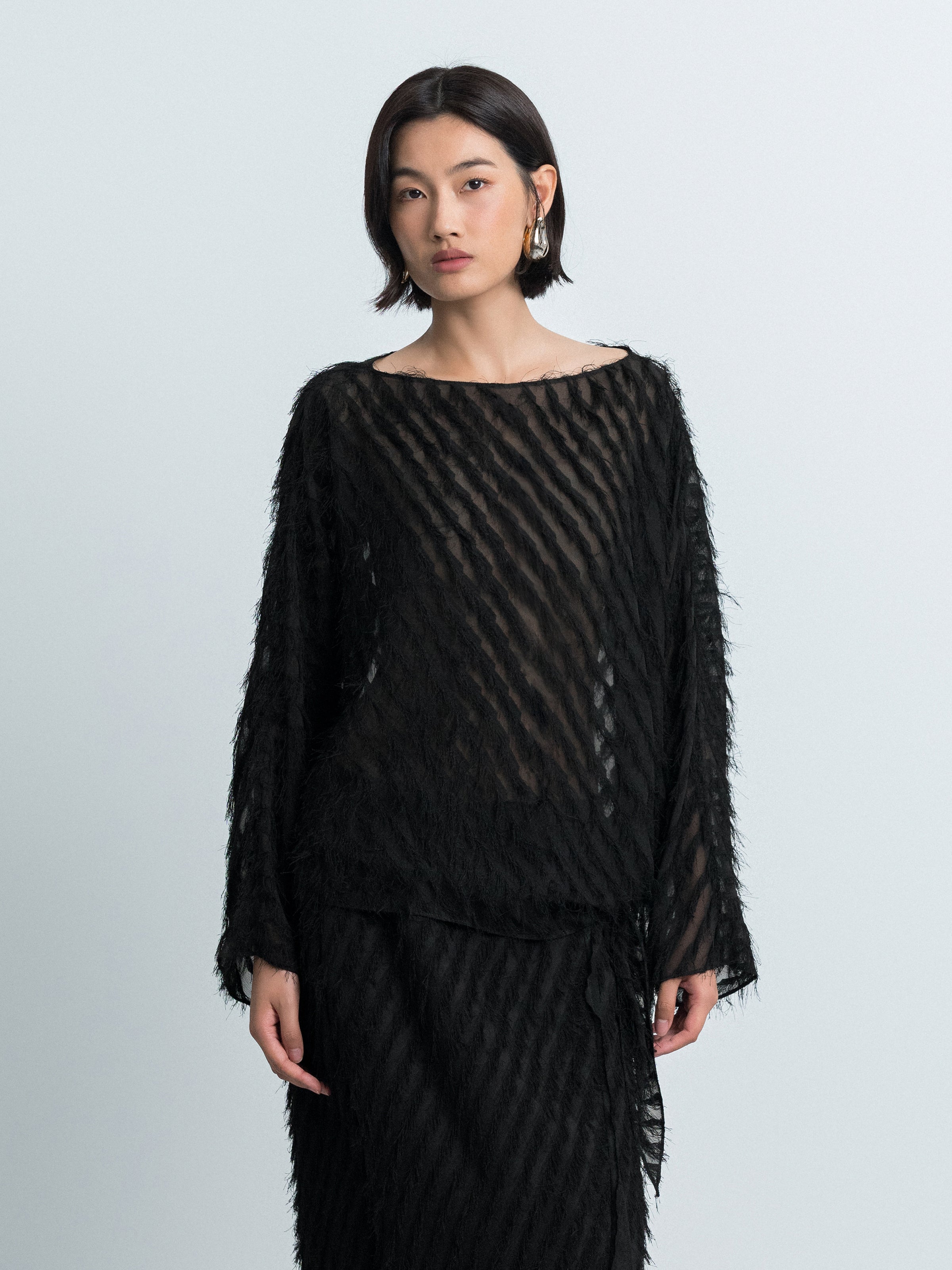 Asymmetric Hem Top with Tassel Details