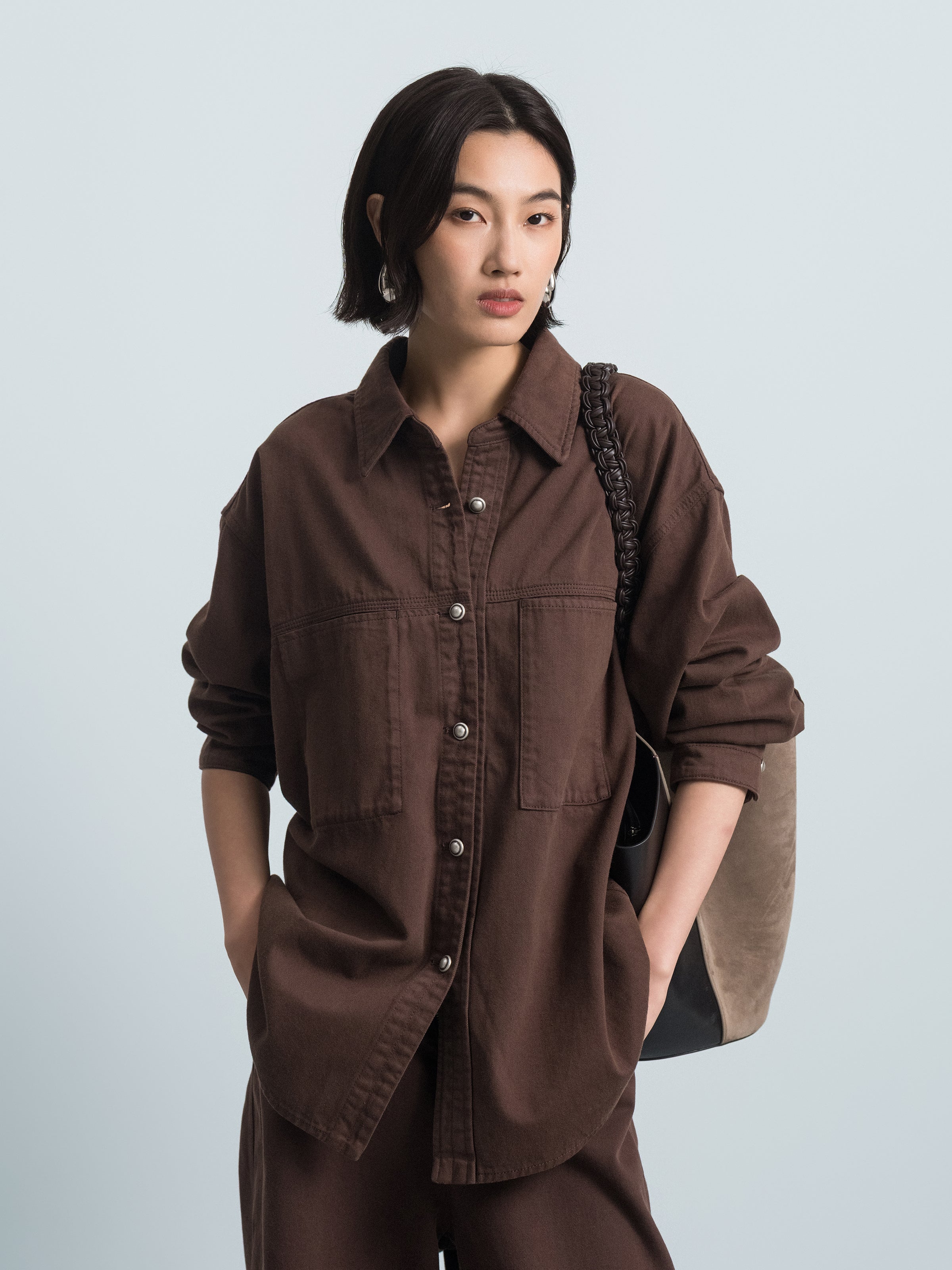 Coffee brown denim shirt close-up: button front, pointed collar, chest pocket