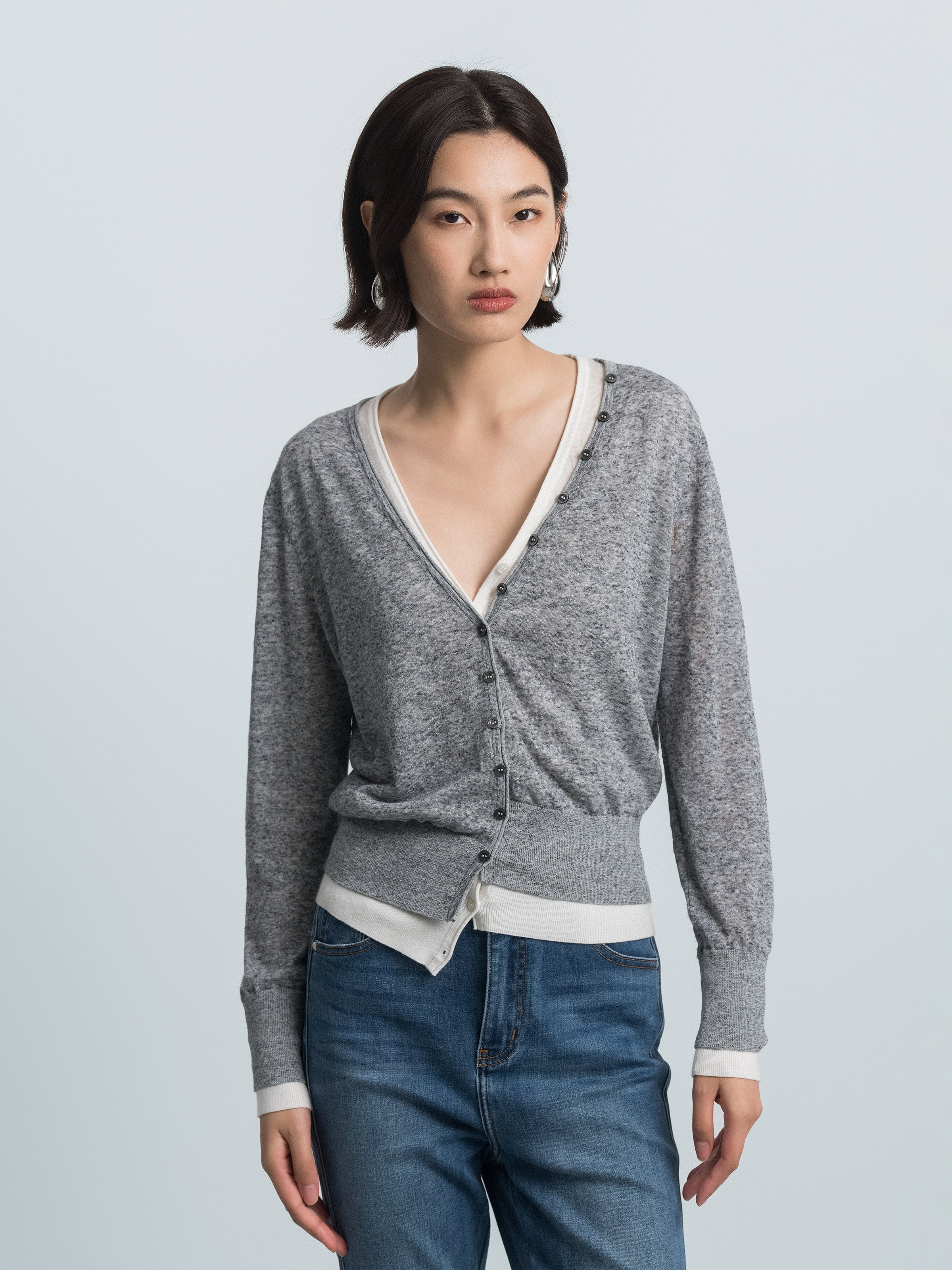 Grey heather knit V-neck cardigan with button front and cream contrast trim