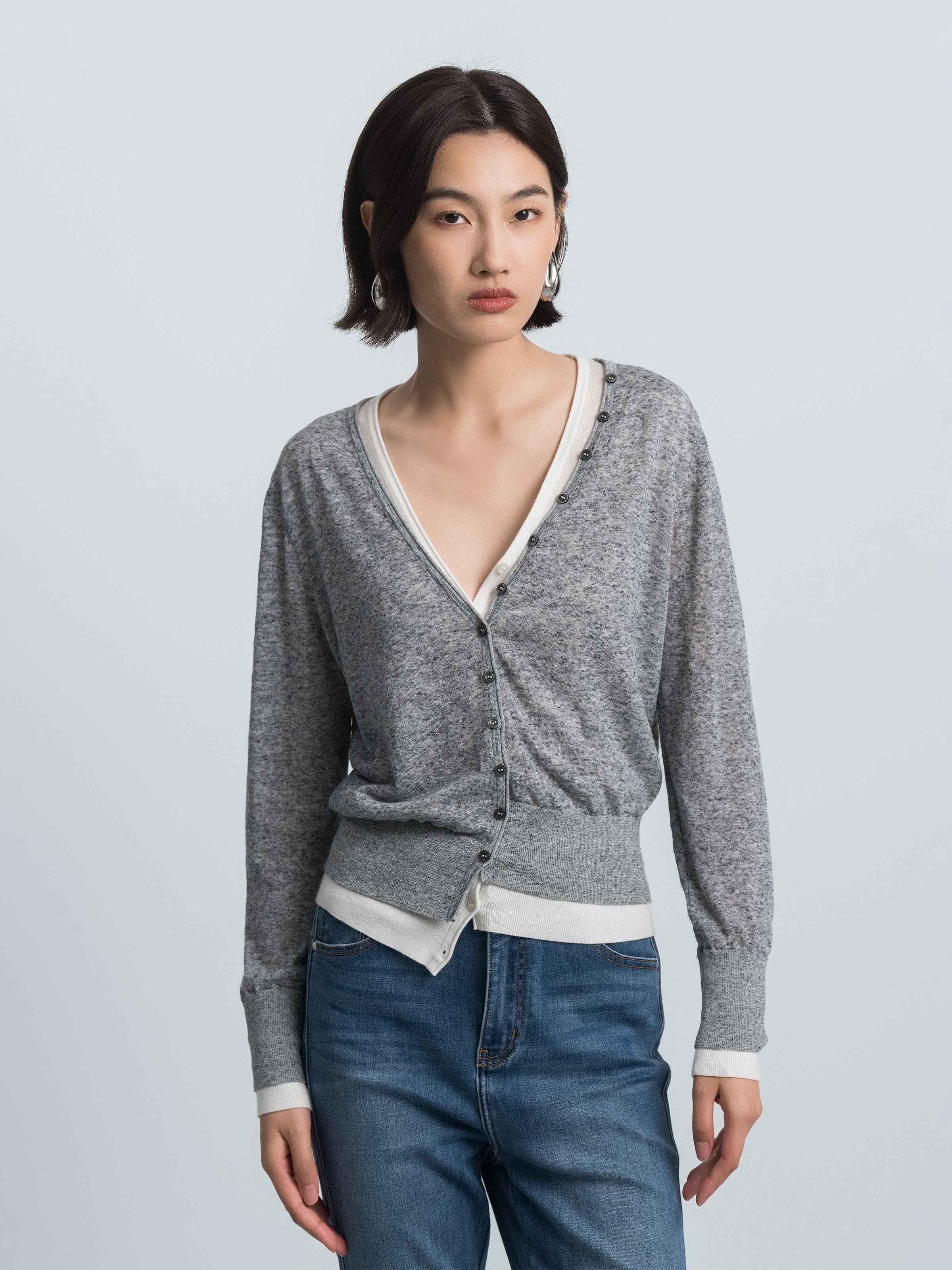 Grey heather knit V-neck cardigan with button front and cream contrast trim