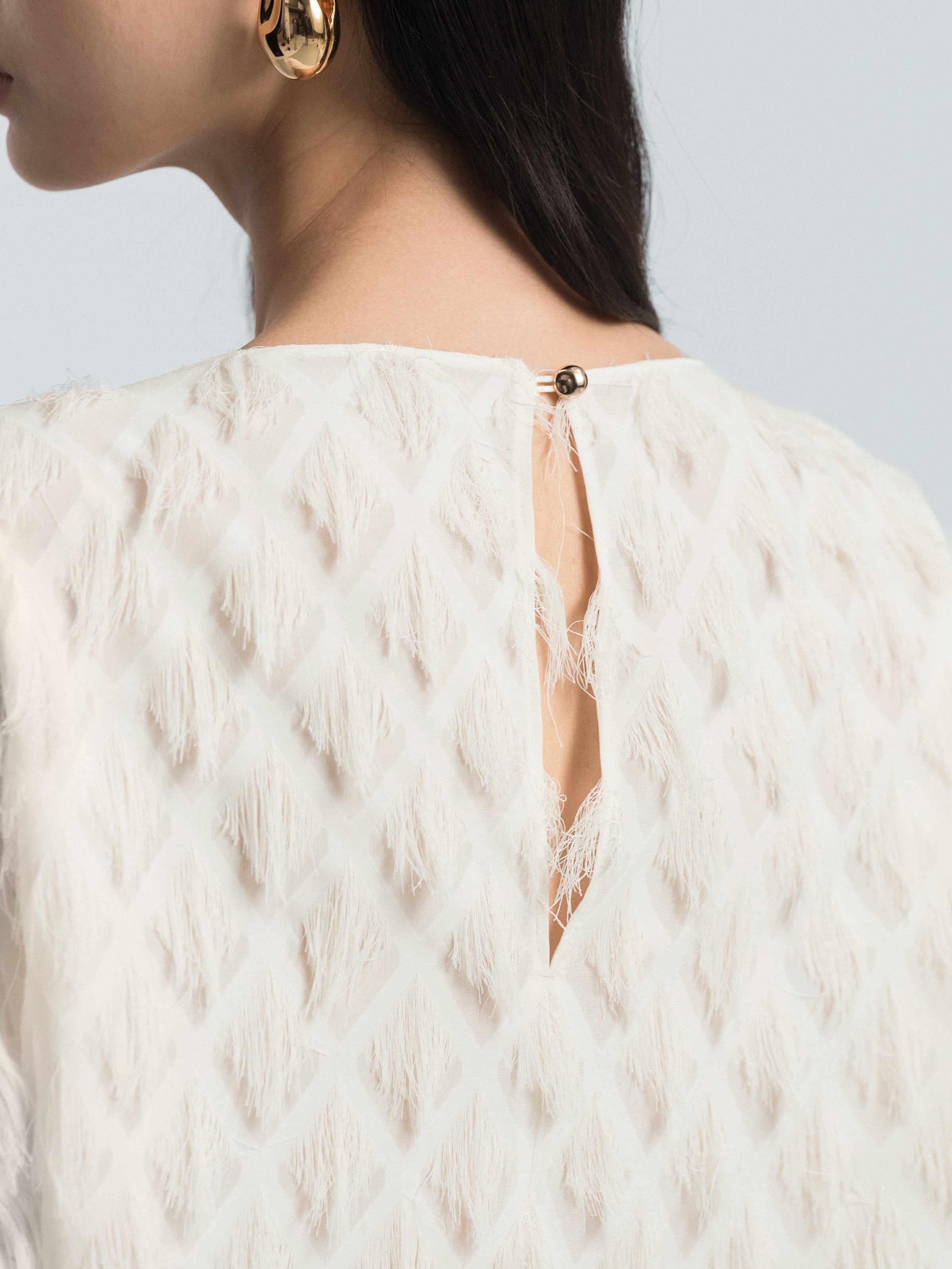 Asymmetric Hem Top with Tassel Details