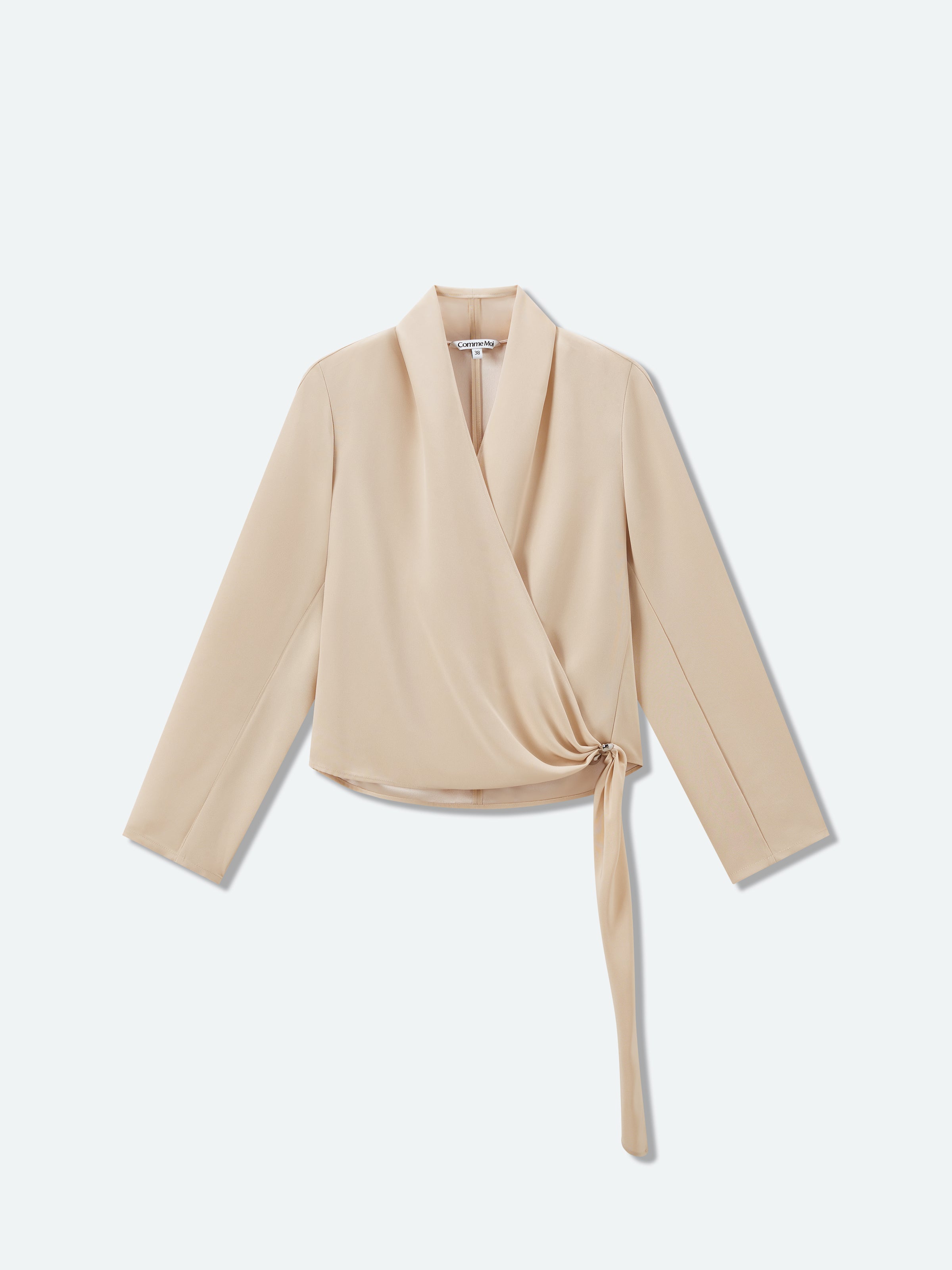 Light beige long-sleeve cross-over top with V-neck and waist tie, shown flat