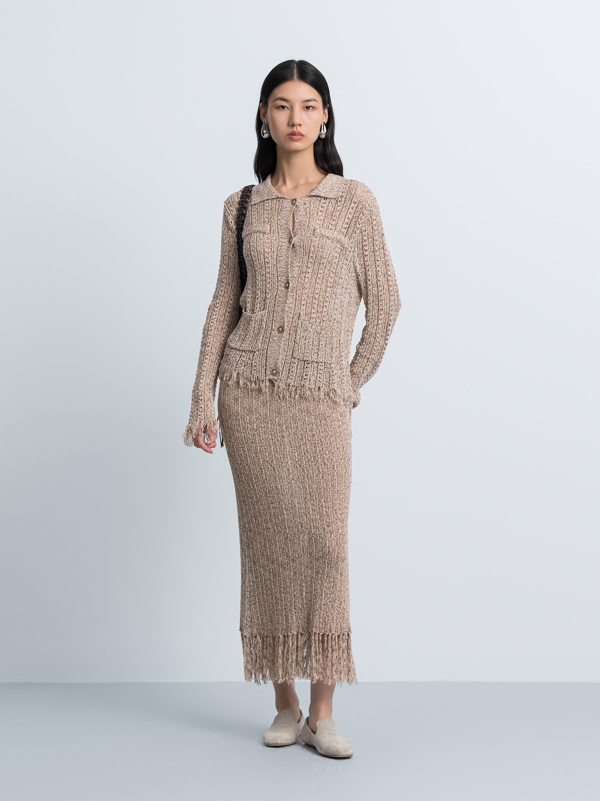 Brown hollow-out knit midi skirt with button placket and fringe hem