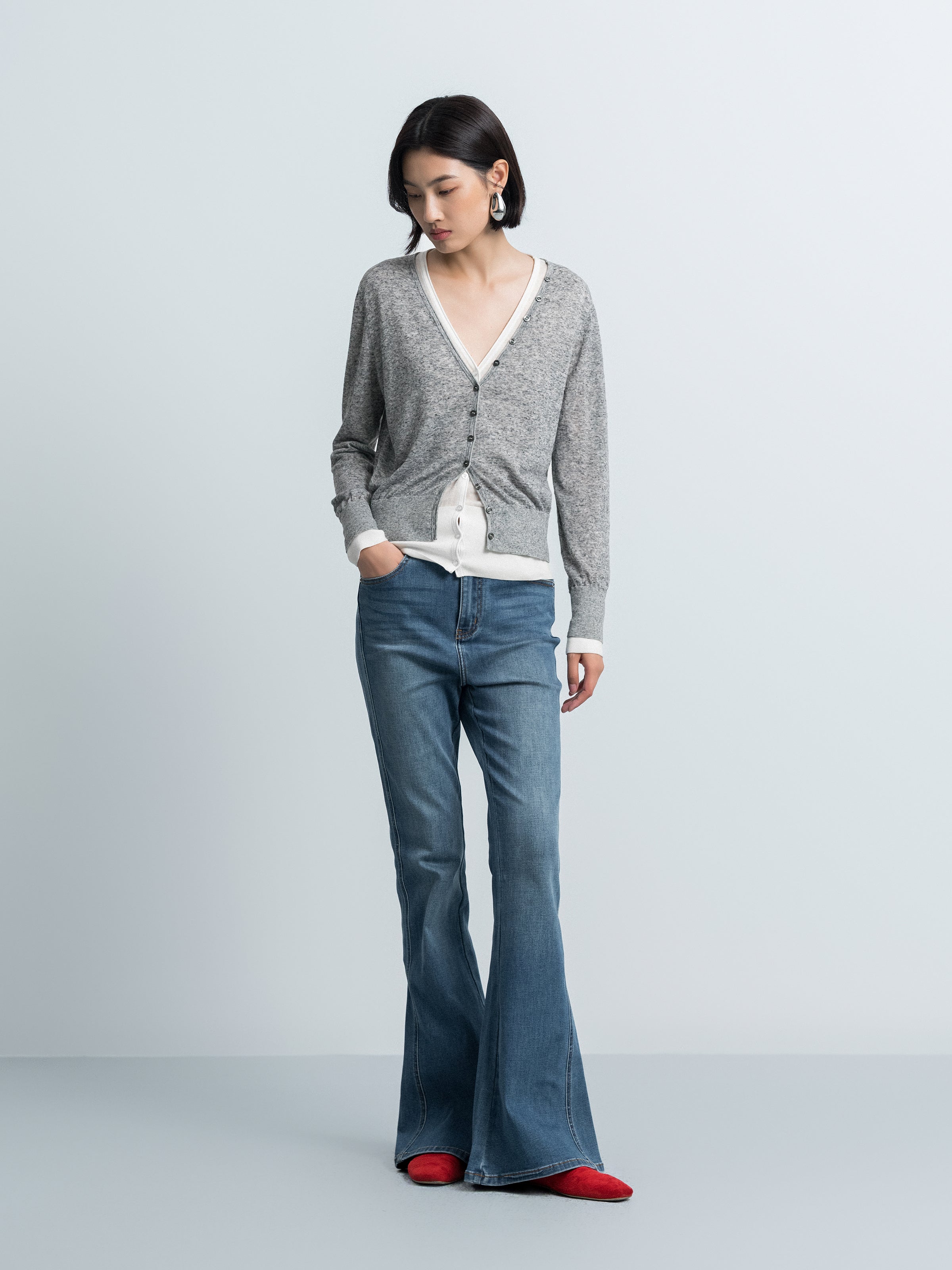 Grey V-neck knit cardigan with button front and contrast cream faux top detail