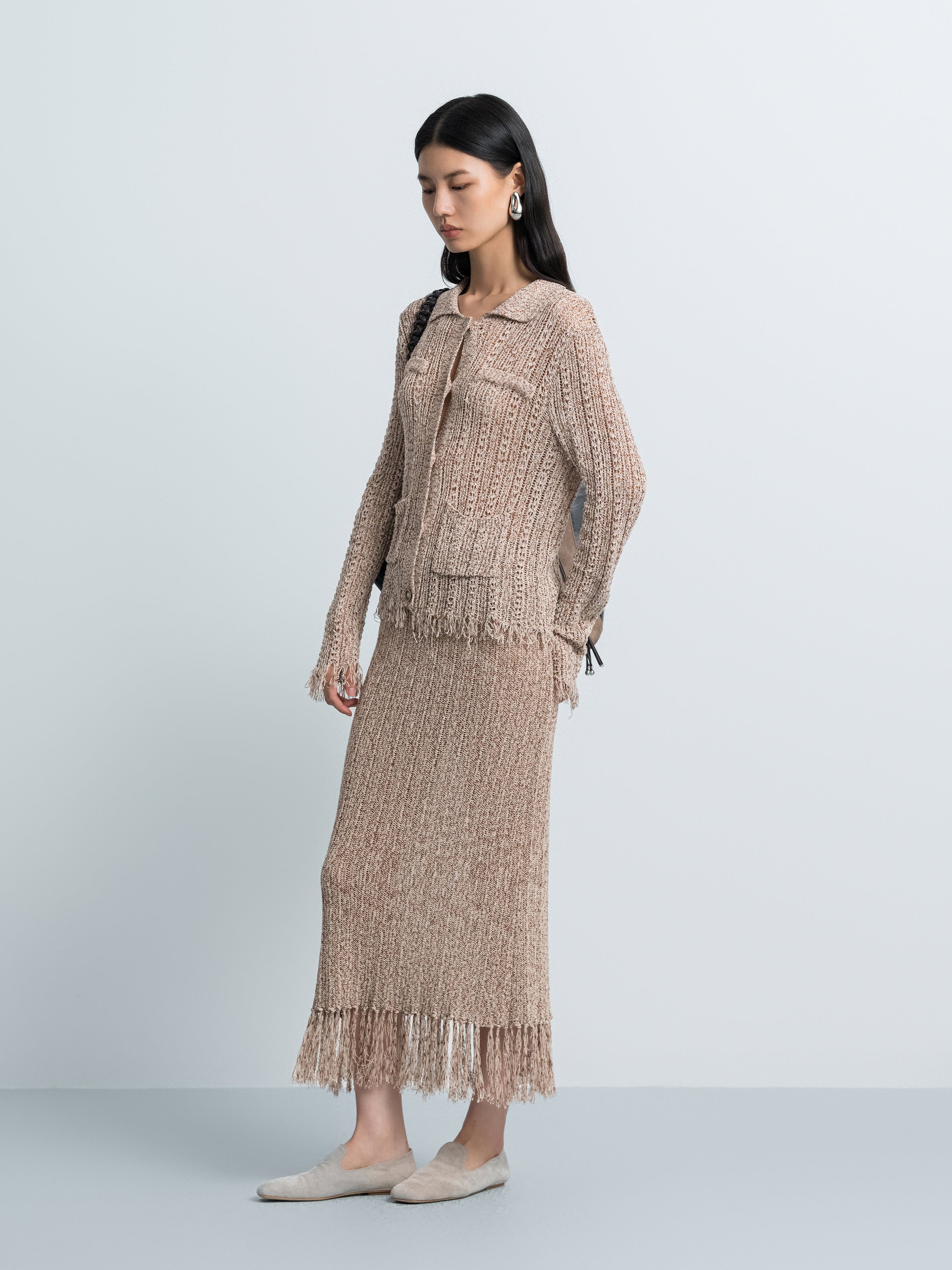 Brown textured knit midi skirt with fringe hem and hollow-out pattern
