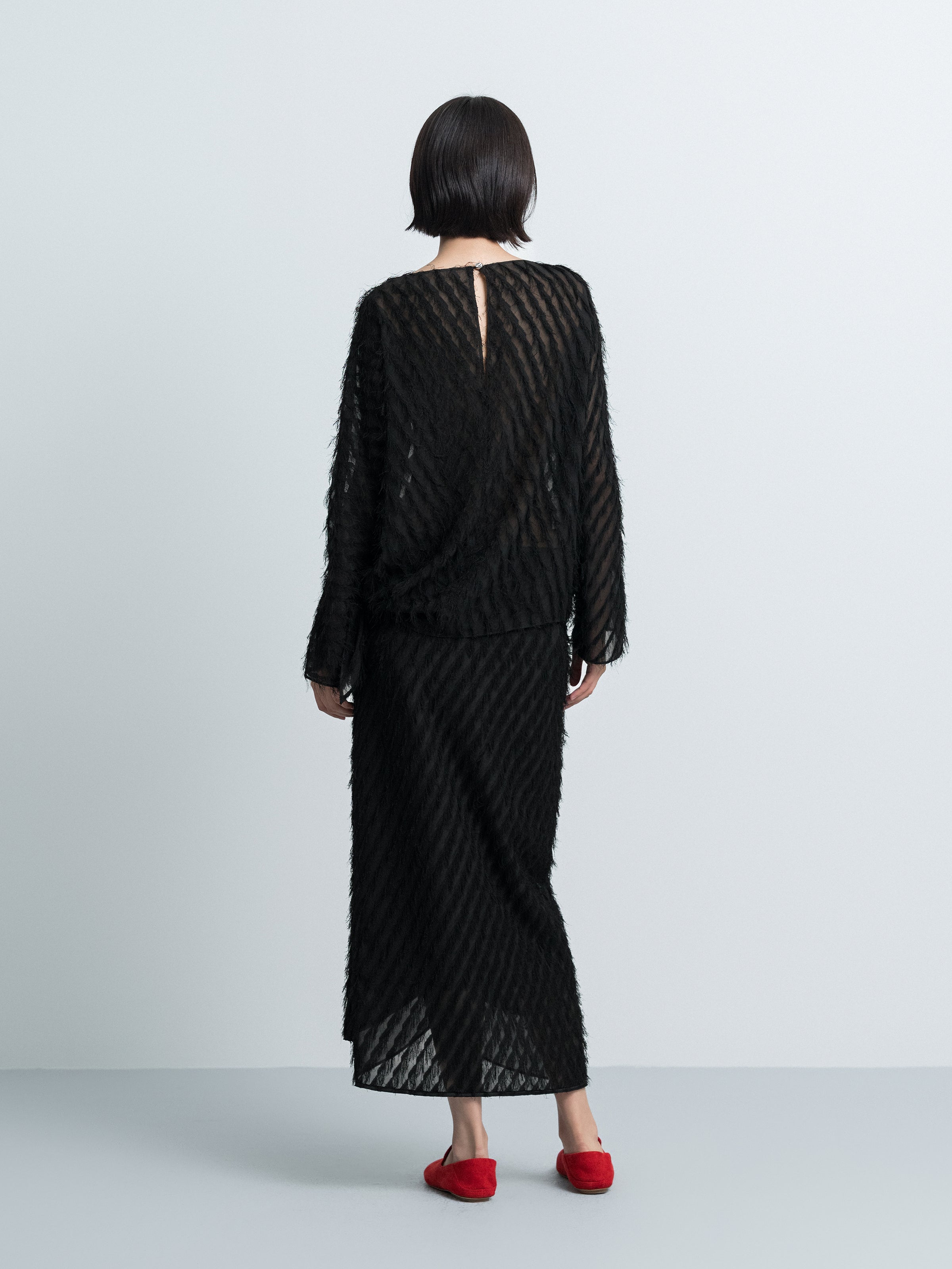 Asymmetric Hem Top with Tassel Details
