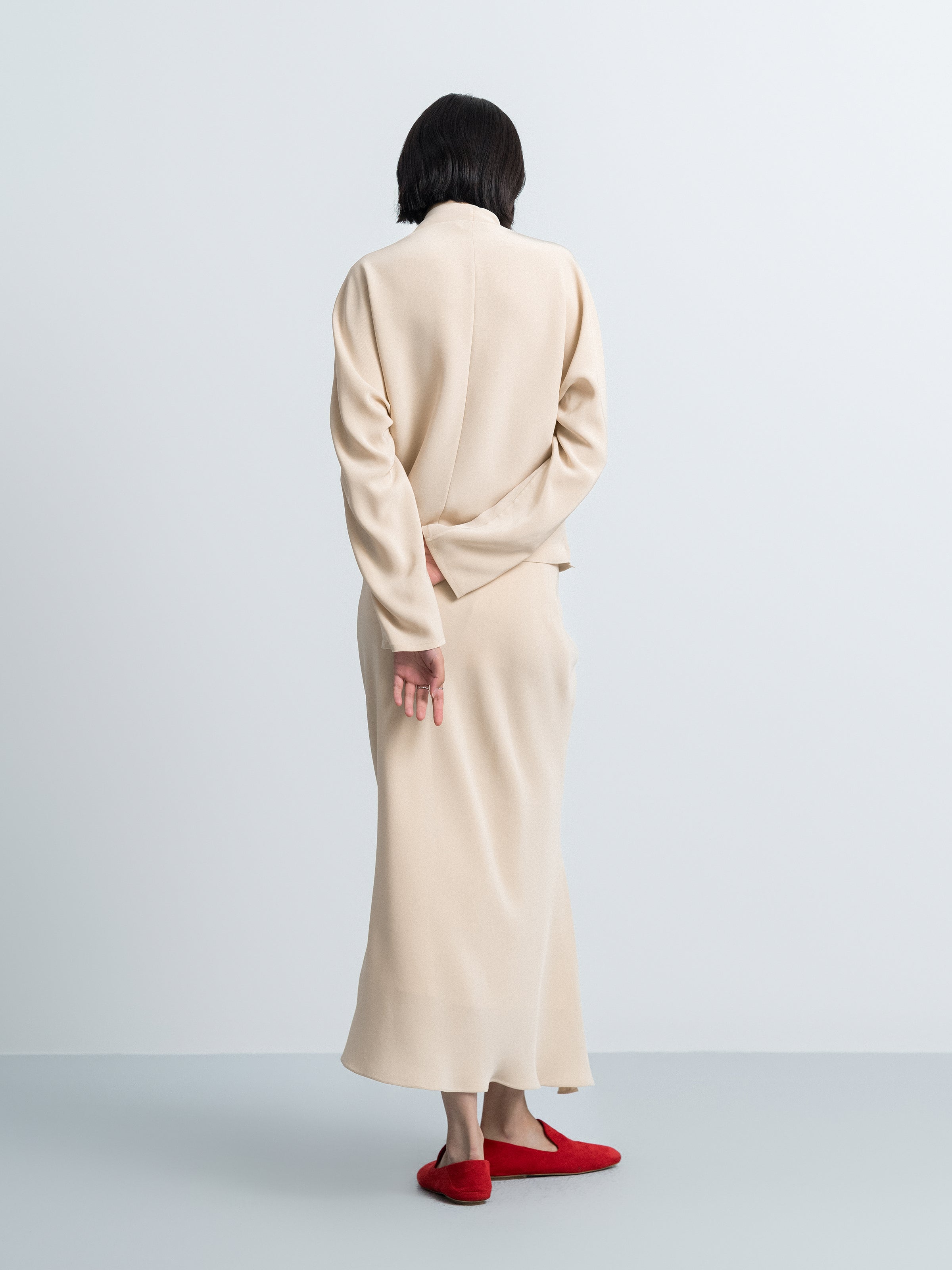 Beige yellow mermaid skirt, back view with waist tie and asymmetric hem