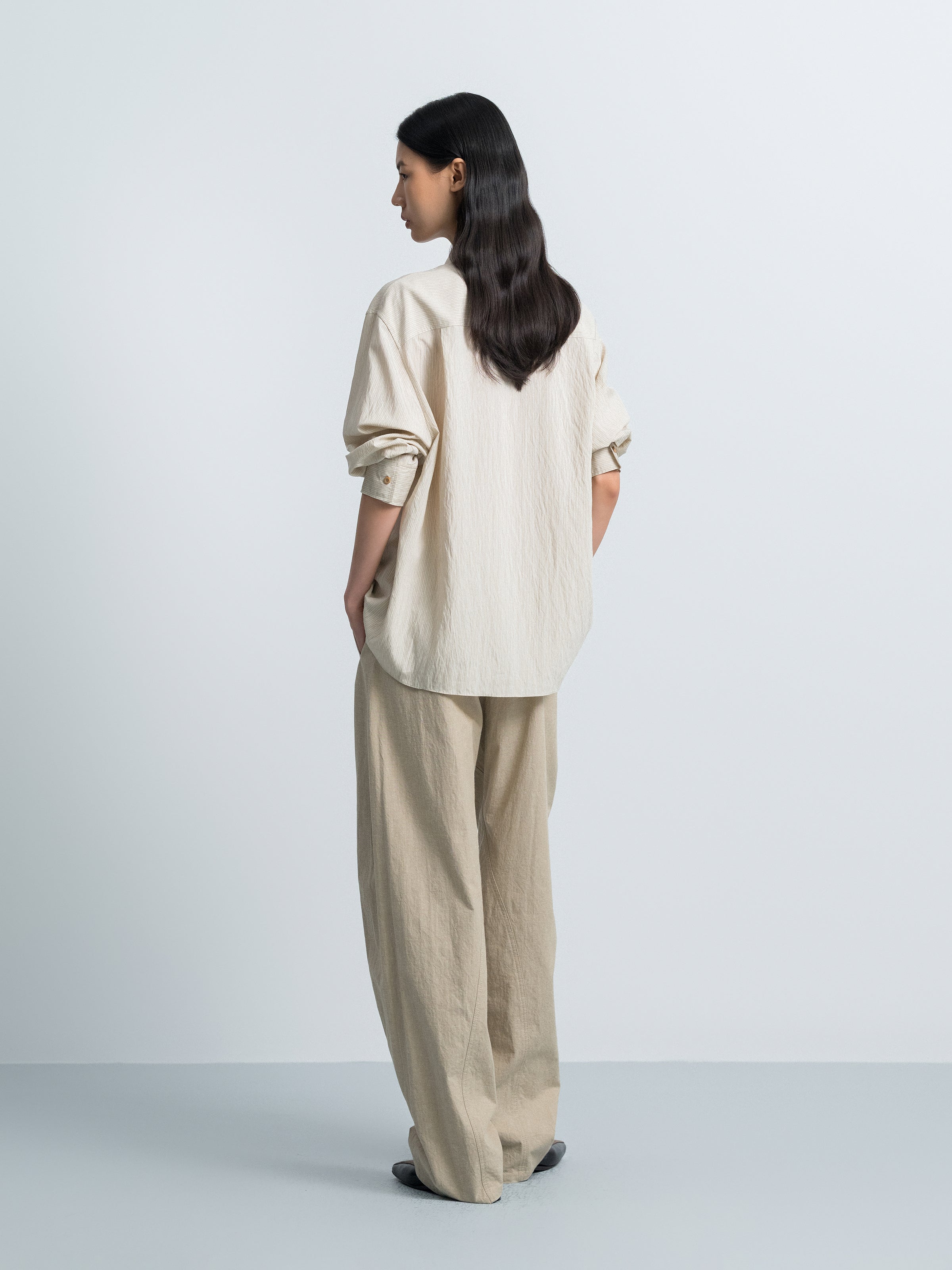 Light beige striped button-up shirt, back view with short sleeves