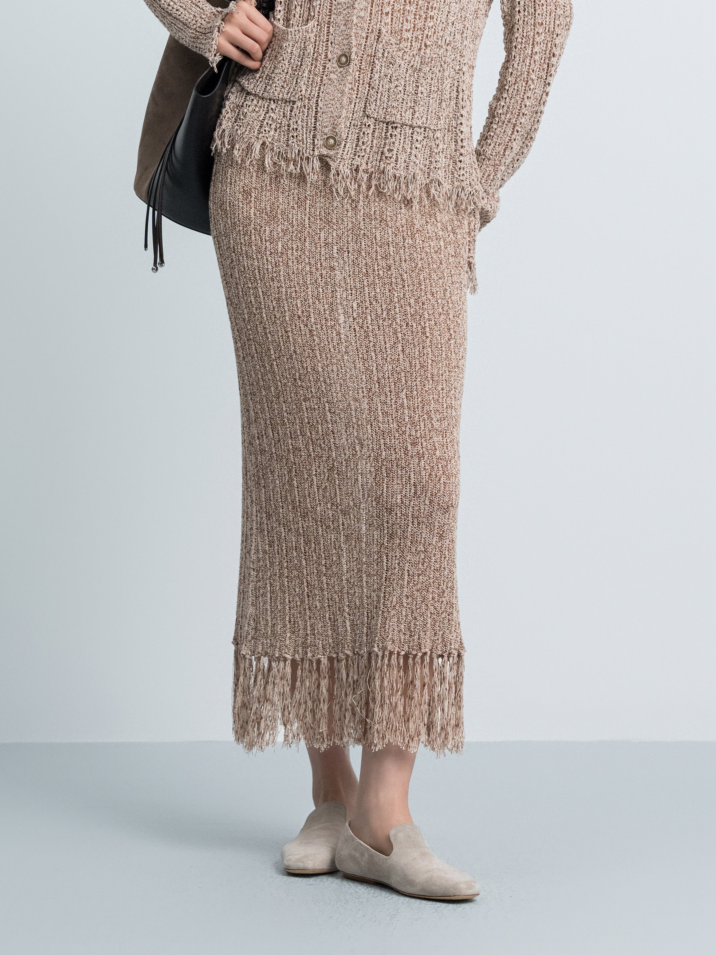 Brown knit midi skirt with button front and straight fit, fringe hem detail