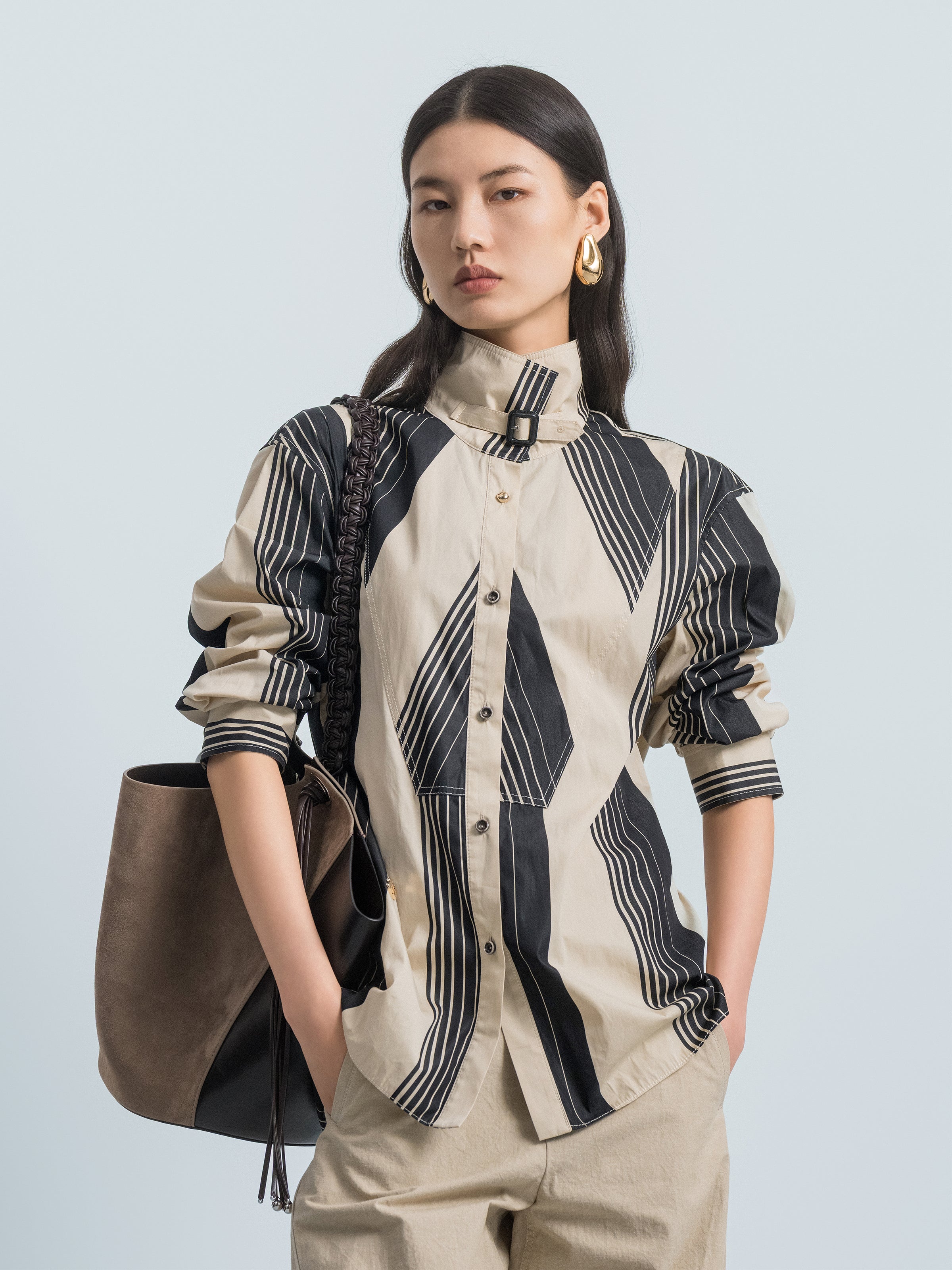 Cream and black striped long-sleeve shirt with stand collar and puffed sleeves