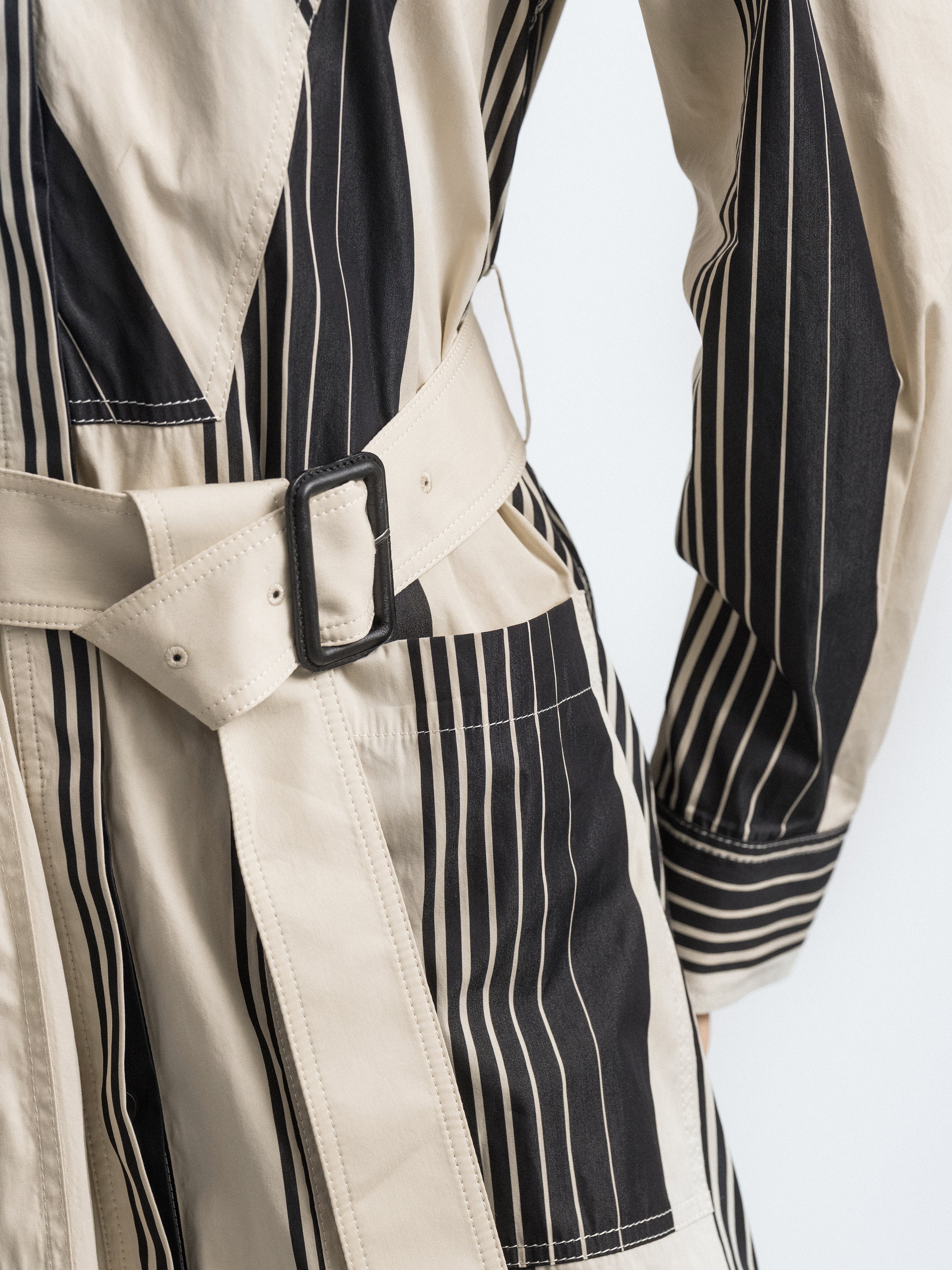 Striped trench coat belt and front button detail, stand collar, black and cream